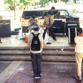 Carbomb & Trigger Quintet tour, Knoxville TN, summer 1995. Carbomb van parked behind the stage while playing Market Square in Knoxville with a couple Trigger Quintet members watching