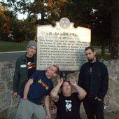another photo in front of a sign for elvis