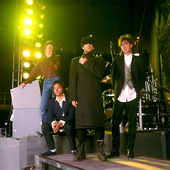 REM poses onstage, Ames, Iowa, March 10, 1989 (Photo by Paul Natkin)