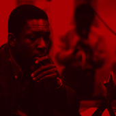 John Coltrane listening as Miles Davis solos