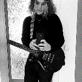 NIE with his guitar