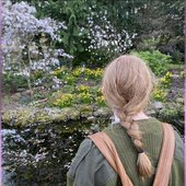 Shannon looking at flowers