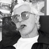 Jimmy-Savile-smoking-cigar-and-wearing-glasses
