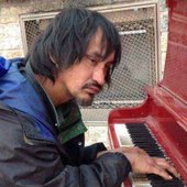 ArcandPianoMan-368x600.jpg