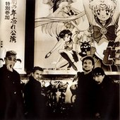 u2_in_front_of_sailor_moon_r_poster.jpg