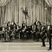 Violinist Leroy Smith and his orchestra posing with musical instruments on stage in New York-crop.jpg