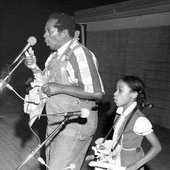 Abner with girl playing bones at the Florida Folk Festival 2