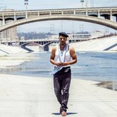 van-hunt-white-tank-beret-scarf-walking-overpass.jpg