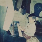 Qingqing-Ye-child-at-piano-1-745x1024.jpg