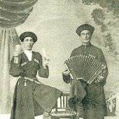 Titu Chesebiev holding rattles (left)