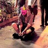 1454573663_AT_-_sitting_on_street.jpg