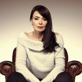 Beverley Craven - brown leather chair.jpg