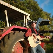 Toby Schuetgens and his red old tractor