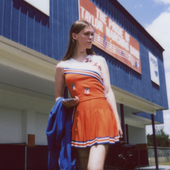 ethel wearing her mom's high schcool cheer uniform - CROPPED