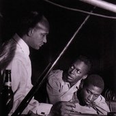 Oscar Pettiford, Miles Davis, and Gil Coggins during the Miles Davis Volumes One and Two session, WOR Studios NYC, May 9 1952 (photo by Francis Wolff)