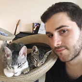 Marc and his two cats, Pupi and Zumi.