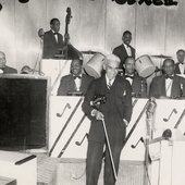 Violinist Leroy Smith and his orchestra posing with musical instruments at the Club Three Sixes-crop.jpg