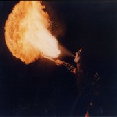 Crom spitting fire during a night in 1999