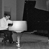 Philip performing on a Bosendorfer grand piano.