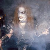 Casting the spell of demonical necromancy.