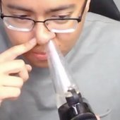 Erick Khan takes a nose dab with e-rig