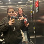 Eve and Izee in a lift