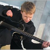 Elena Perova playing a guitar