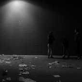 urban setting, lots of garbage, possibly night