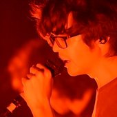 Will Toledo singing into a Mic