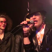 Peter Olive performing with Adam Ant