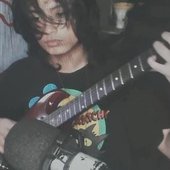 rye playing his guitar