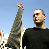 Yves with his 12string fretless Jerzy Drozds