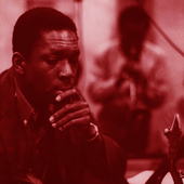 John Coltrane listening as Miles Davis solos