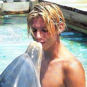 Nick kissing a dolphin! =D &lt;3