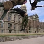 Goes Cube Jumping in Front of State Capitols