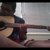 Ocular Red playing his own guitar
