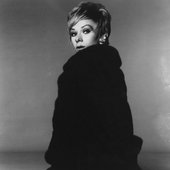 Tammy Grimes wearing a Black Furry Coat