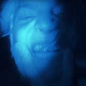 Thirty Nights (screenshot from "Blue Nitrile Touch" music video)