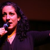 Eman El-Husseini performing stand-up.