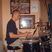 Playing drums.