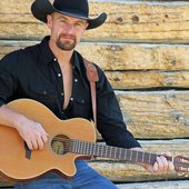 Nephi Clark Allred with his guitar