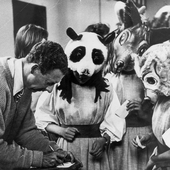 Britten signing autographs for children in the opera Noye's Fludde, 1958