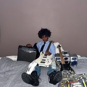 Carpe Diem (rapper) with guitar, July 2025