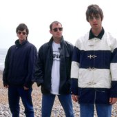 Oasis - photographed on Brighton Beach. 19th June 1994