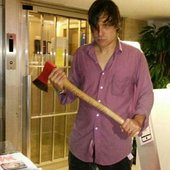 John Maus holding an axe