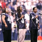 Los Lonely Boys singing at the Football