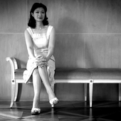 Mari Kodama on a bench