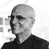 Jimmy Iovine looks to the side while smiling