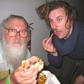 R. Stevie Moore and Joey Pizzaslice sharing a sammich.