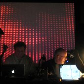 On stage at the Spark Fest in 2007 with video backdrop by R. Luke DuBois.